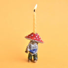 Mushroom Gnome Cake Topper on a yellow background