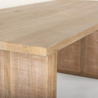 Close up of Grier 84 inch long Light Brown Wood with Cane Dining Table on a white background