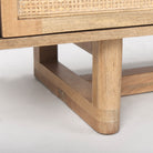 Close up of Grier Light Brown Solid Wood and Cane 3 Door Media Console on a white background