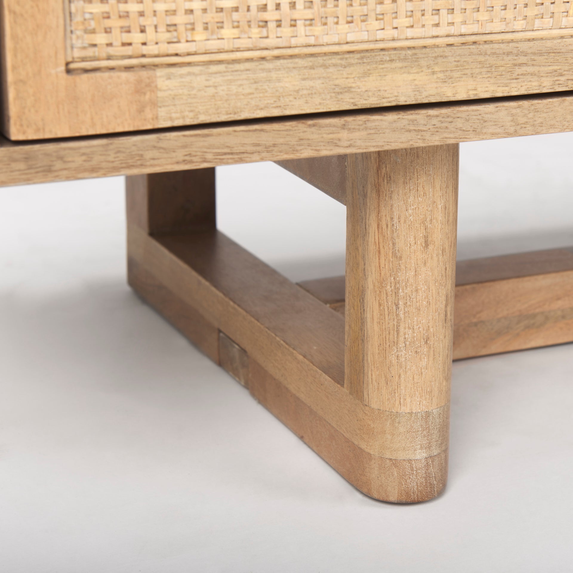 Close up of Grier Light Brown Solid Wood and Cane 3 Door Media Console on a white background