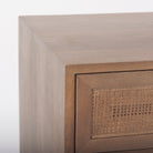 Close up of Grier Medium Brown Wood with Cane Accent Table on a white background