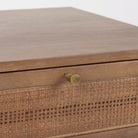 Close up of Grier Medium Brown Wood with Cane Accent Table on a white background
