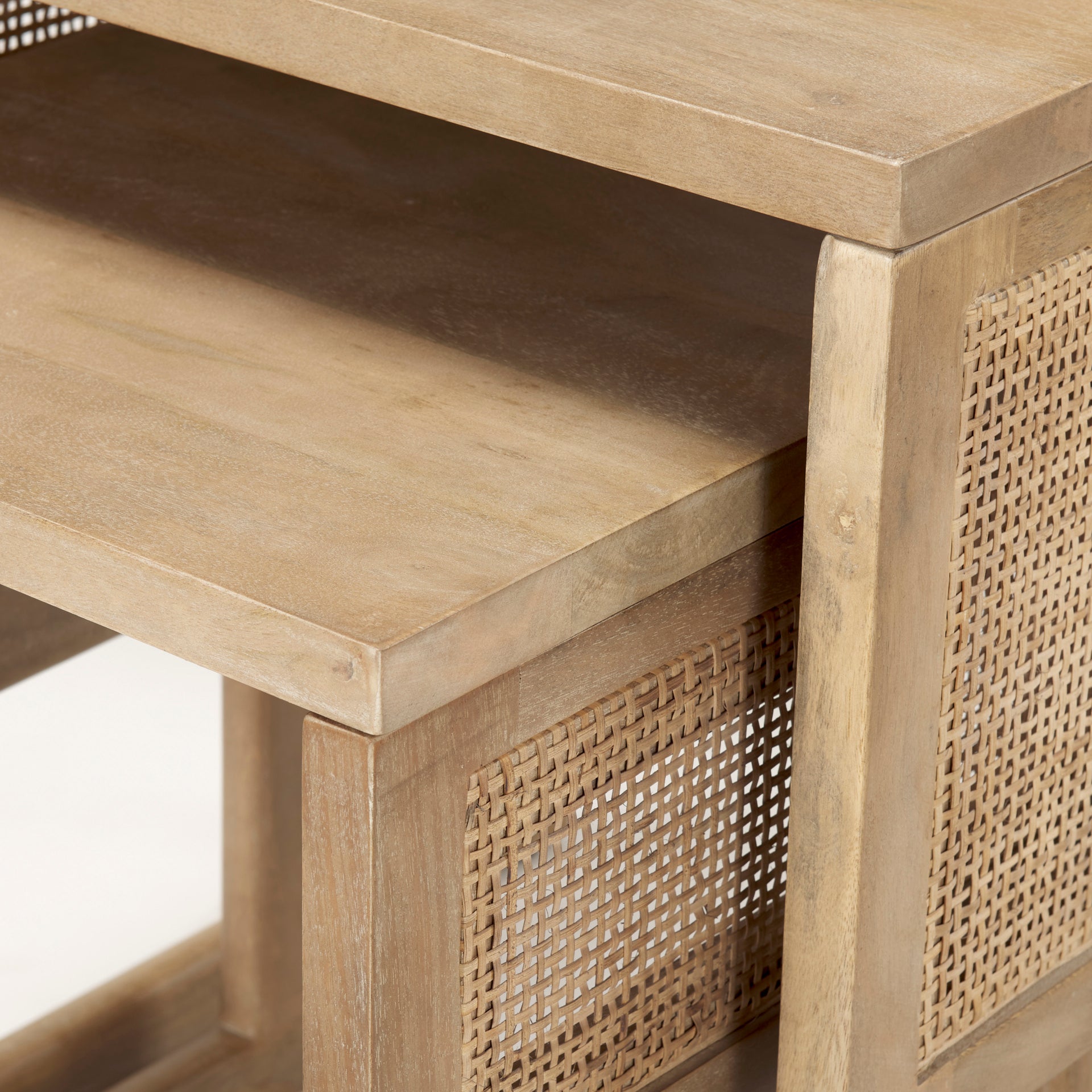Close up of Grier Set of 2 Light Brown Solid Wood with Cane Nesting Accent Tables on a white background