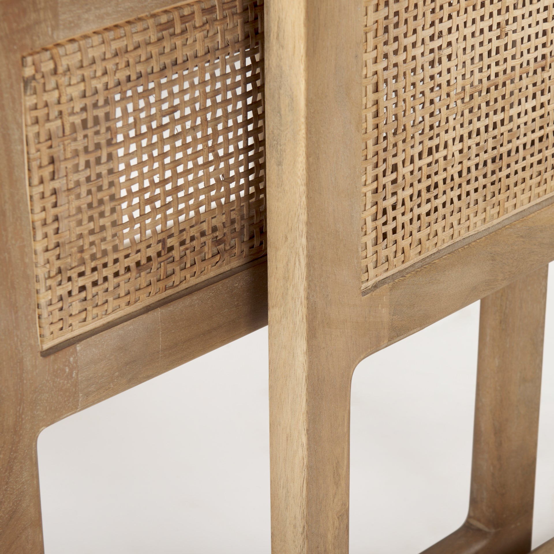 Close up of Grier Set of 2 Light Brown Solid Wood with Cane Nesting Accent Tables on a white background