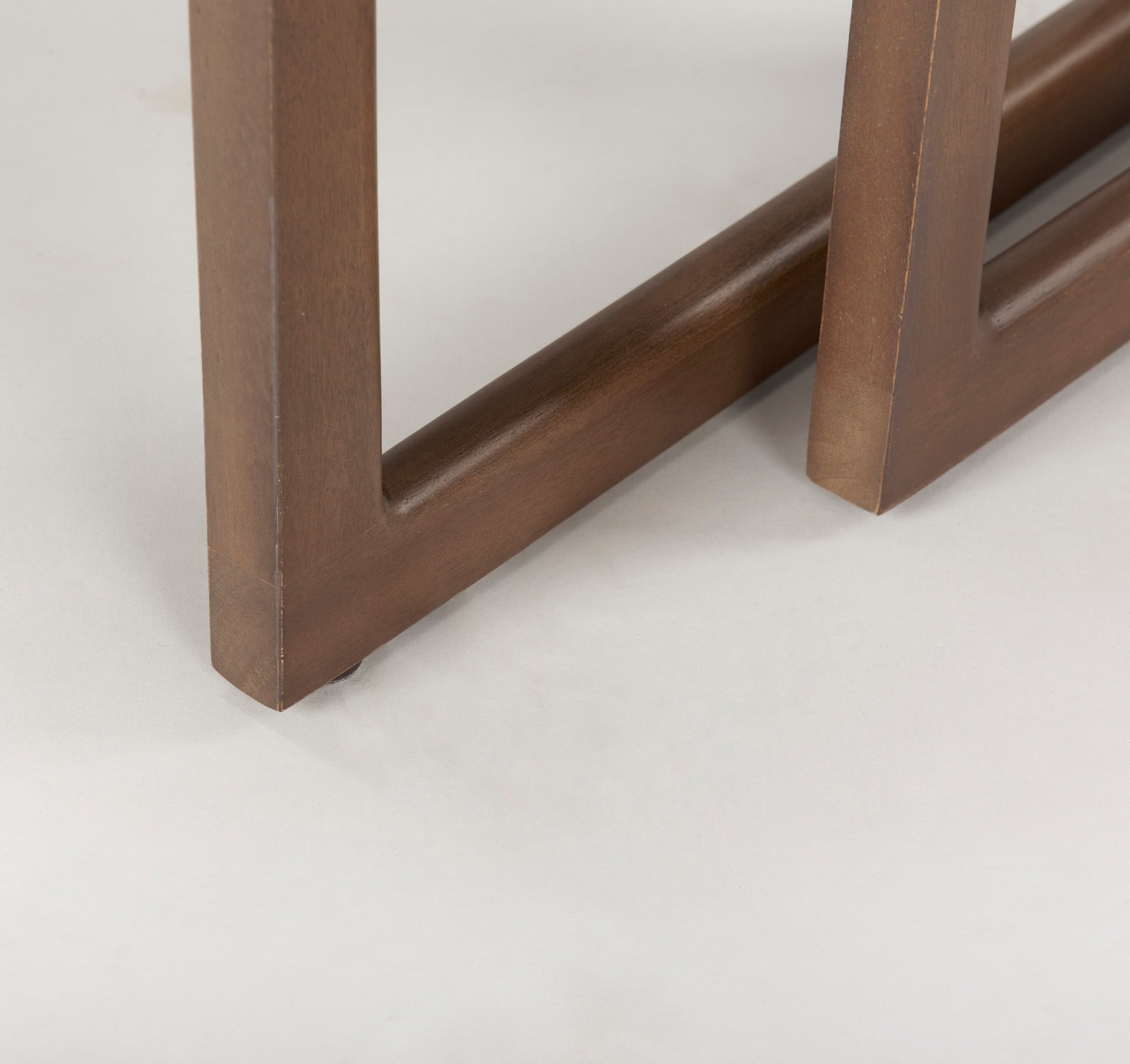 Close up of Grier Set of 2 Medium Brown Solid Wood with Cane Nesting Accent Tables on a white background