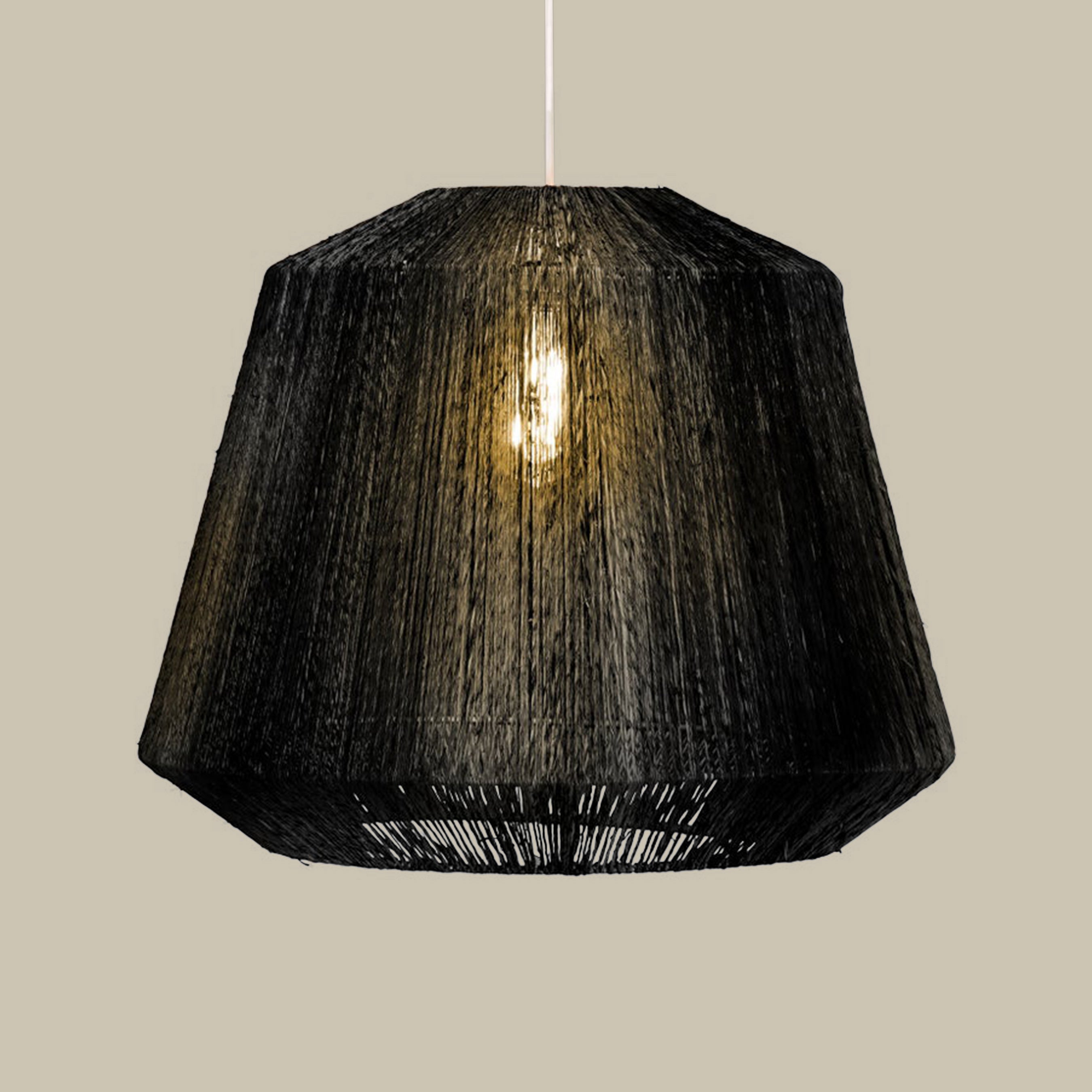 Manhattan Jute Pendant in Black on a beige background at Addison West