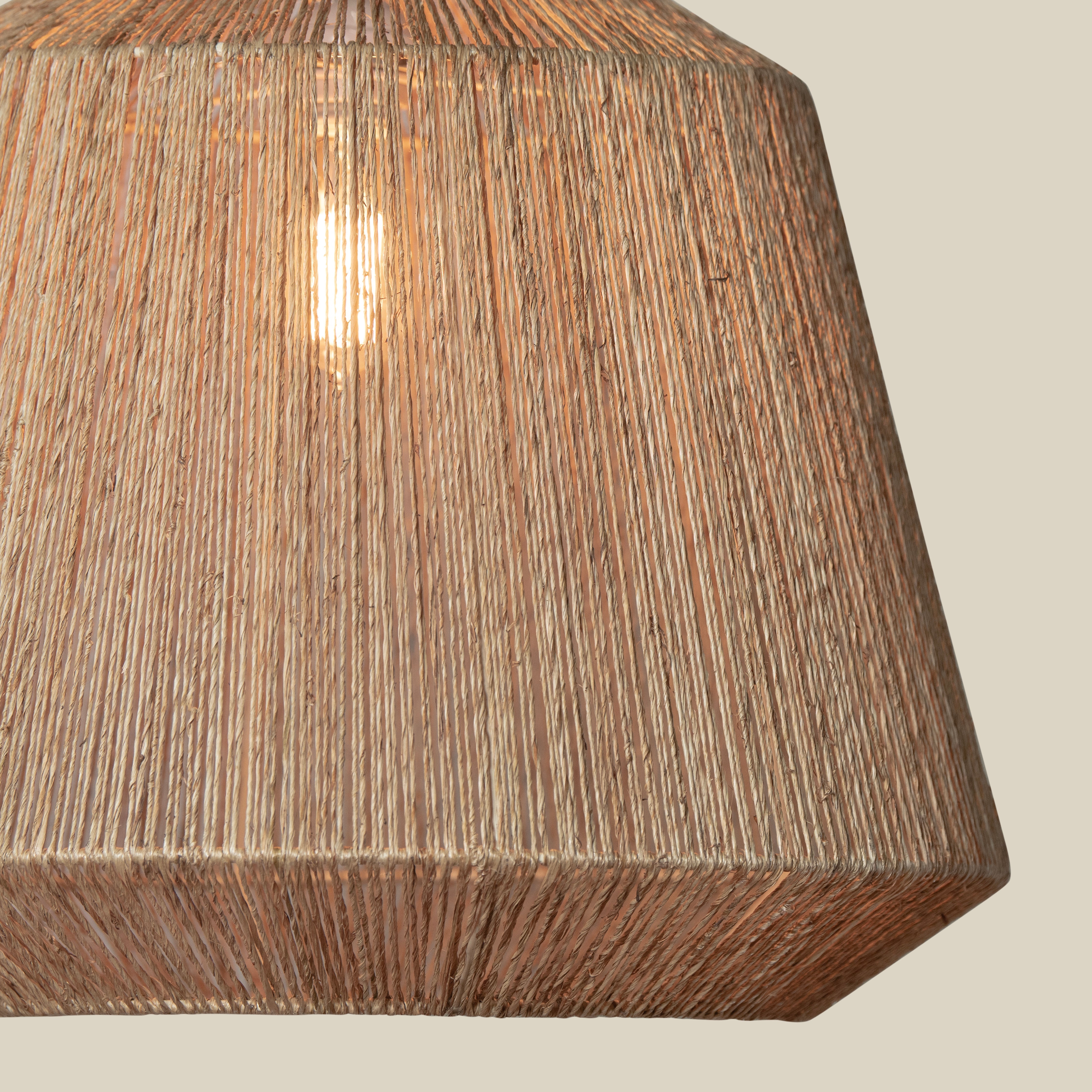 Close up of Manhattan Jute Pendant in Natural on a beige background at Addison West
