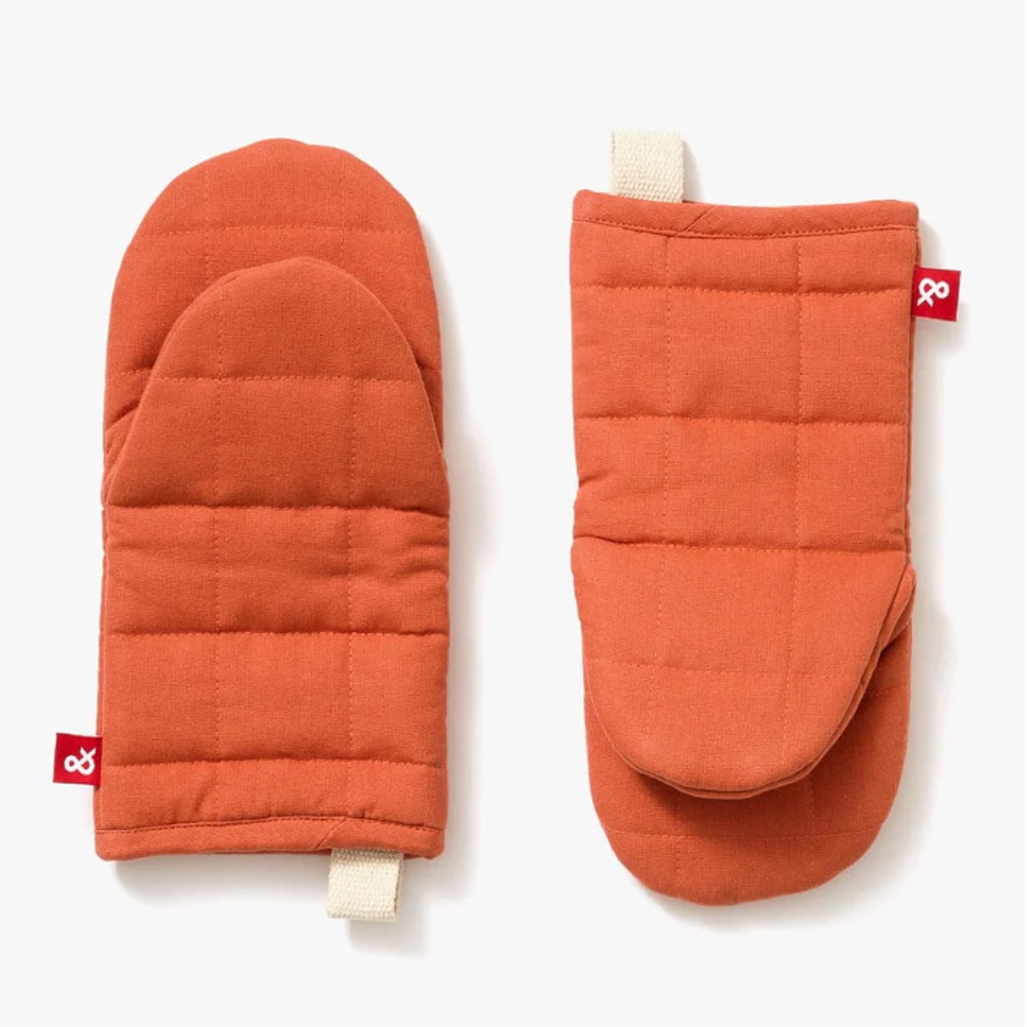 Hedley & Bennett Paprika Oven Mitts on plain background at Addison West.