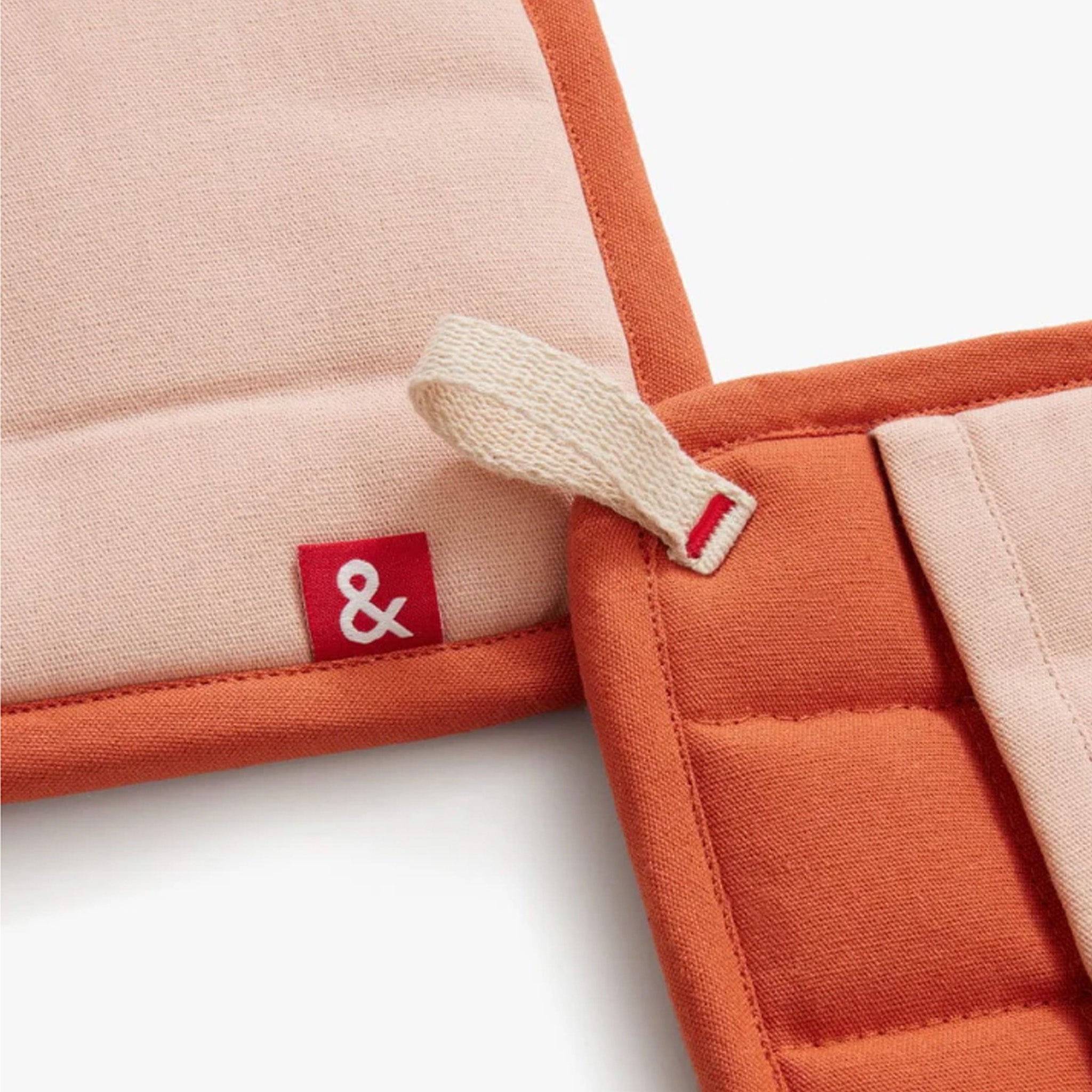 Hedley & Bennett Paprika Pot Holders on plain background at Addison West.