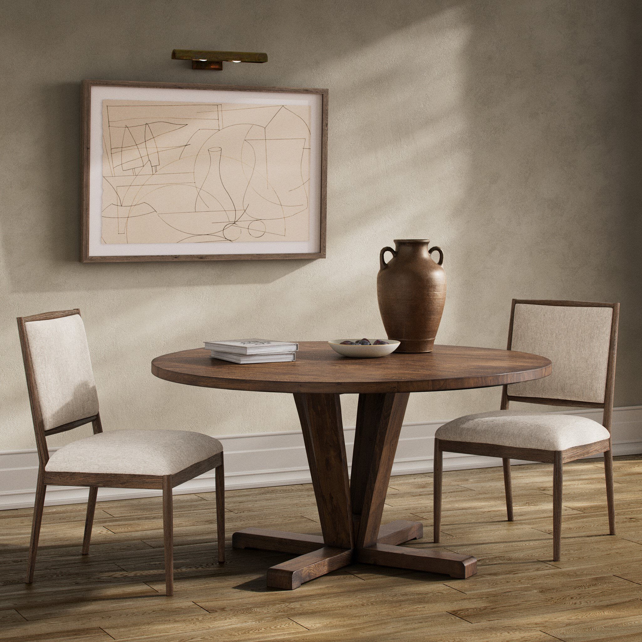 Four Hands Cobain Round 60" Dining Table in Reclaimed Mango in a modern dining room