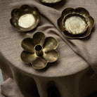 Forged Flower Candle Holder on a brown table at Addison West