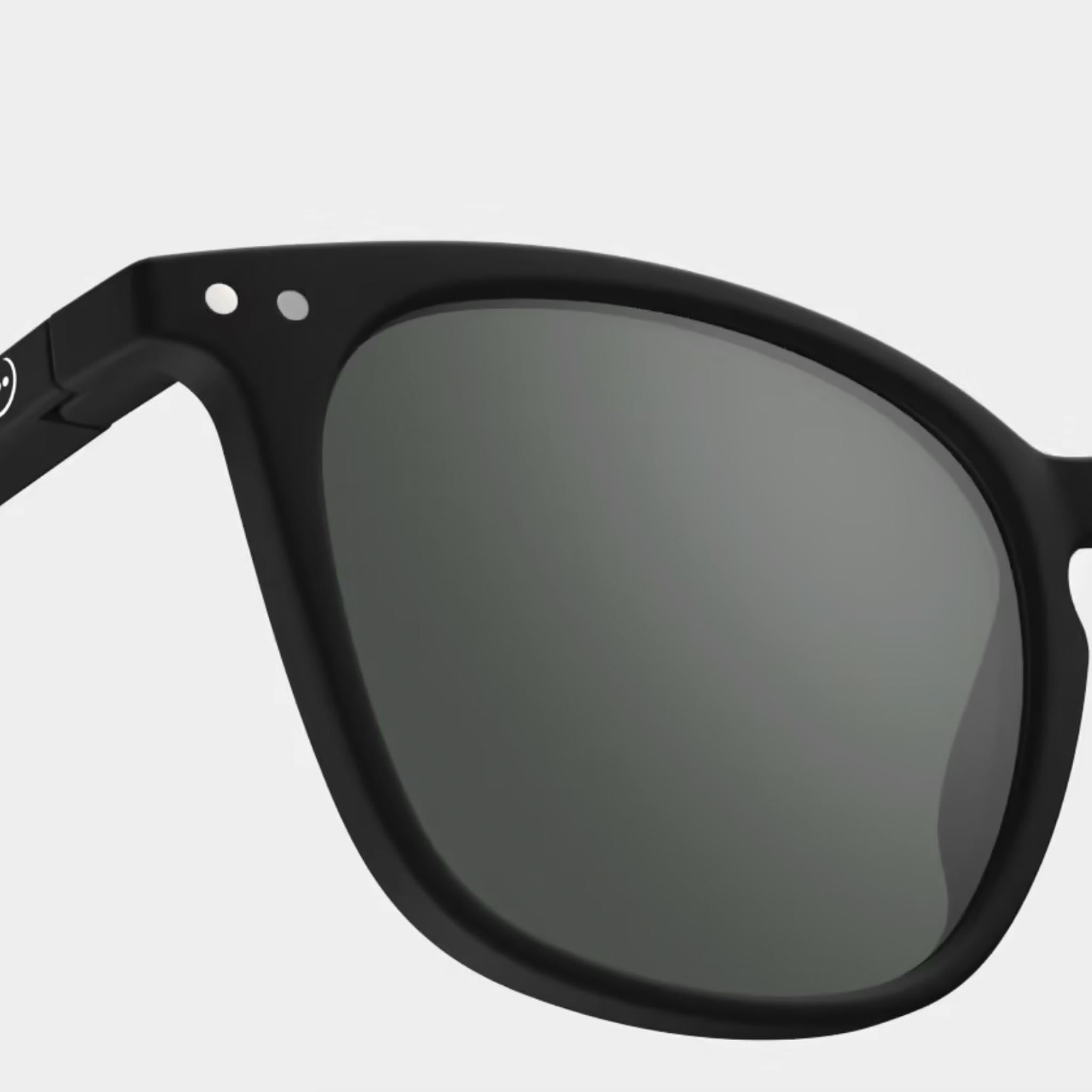 Izipizi #E Black Sunglasses on a white background at Addison West