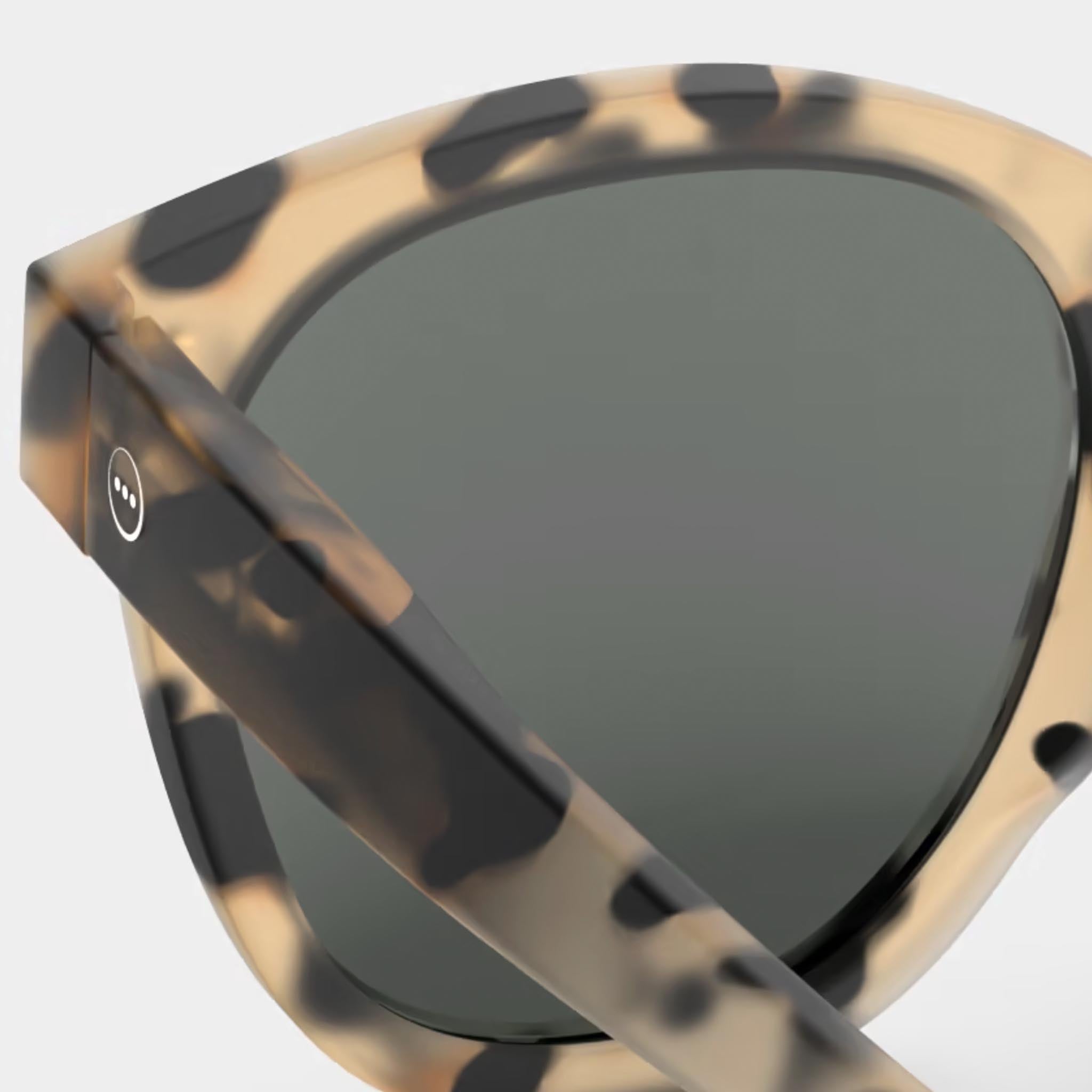 Izipizi #N Light Tortoise Sunglasses on a white background at Addison West