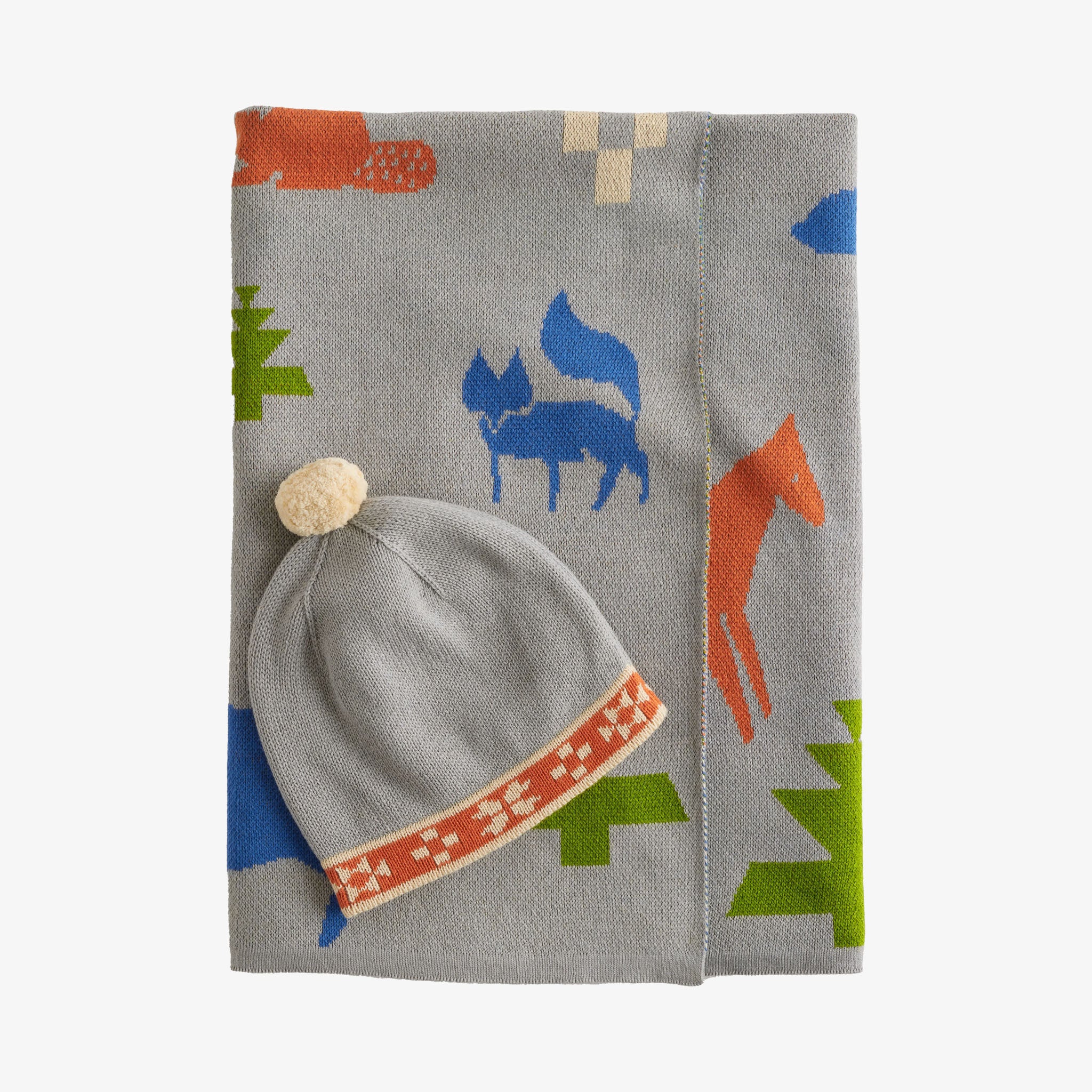 Gray baby hat and scarf set with fox and tree patterns on a white background