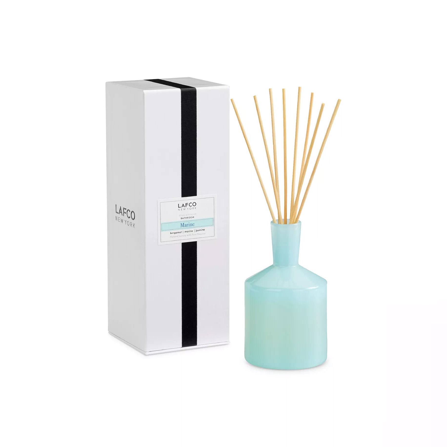 Blue Lafco diffuser bottle with wooden sticks and white packaging on a white background