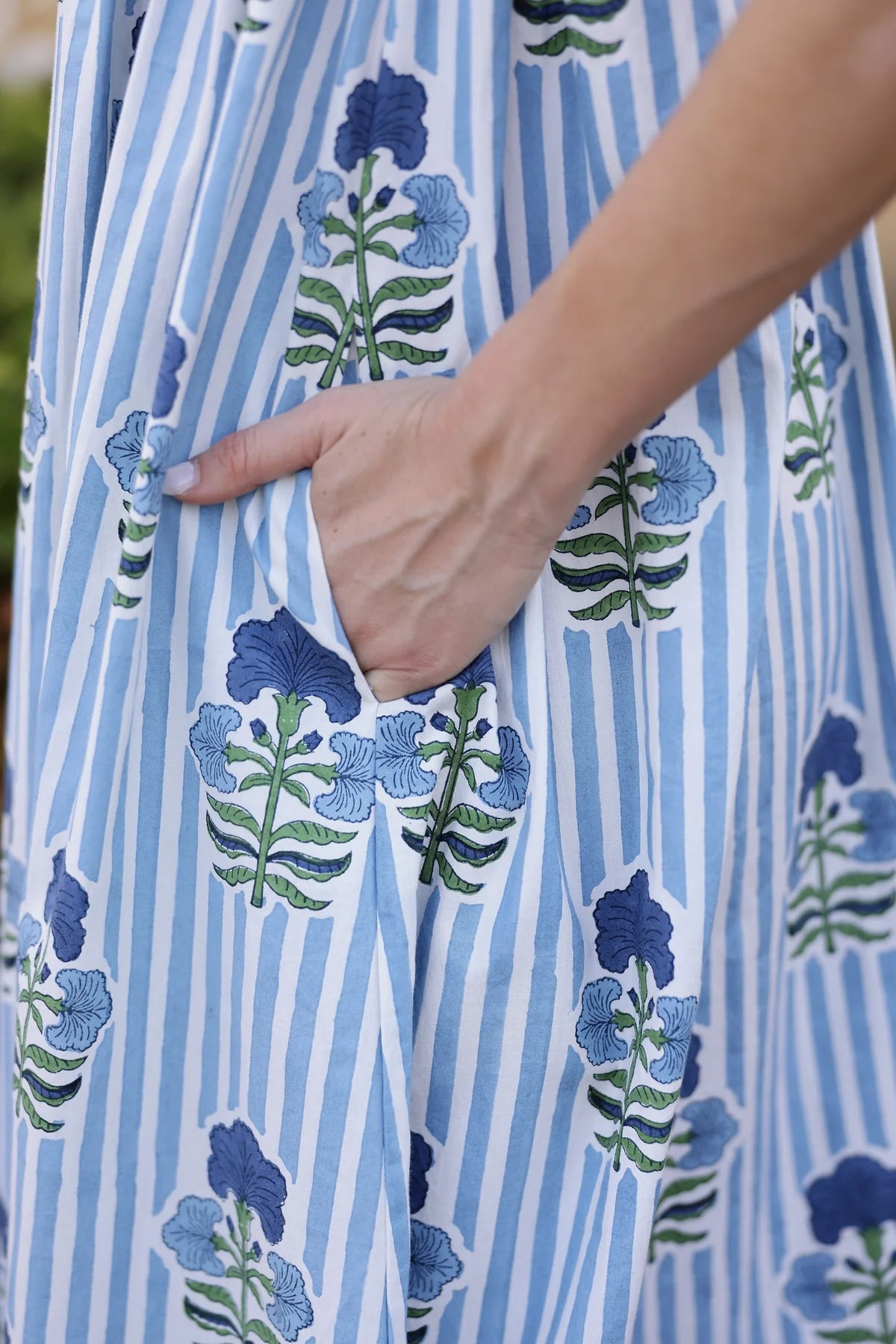Maison Marigold Laguna Dress in Blue and Green on a model at Addison West
