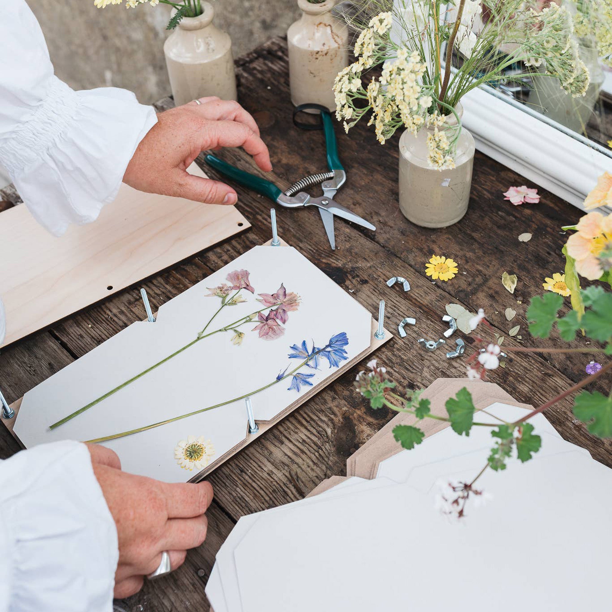 Large flower press on craft table at Addison West.