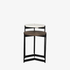 Round nesting side tables with black frames on a white background