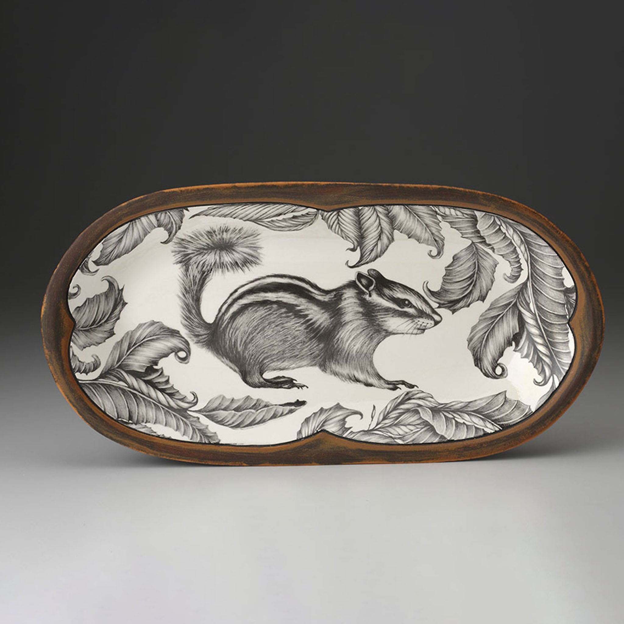 Decorative plate with a chipmunk design on a plain background