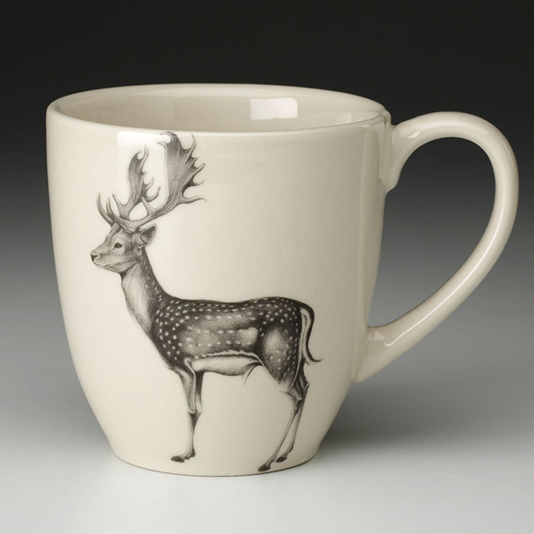 Laura Zindel Fallow Buck Mug with white interior on grey background.