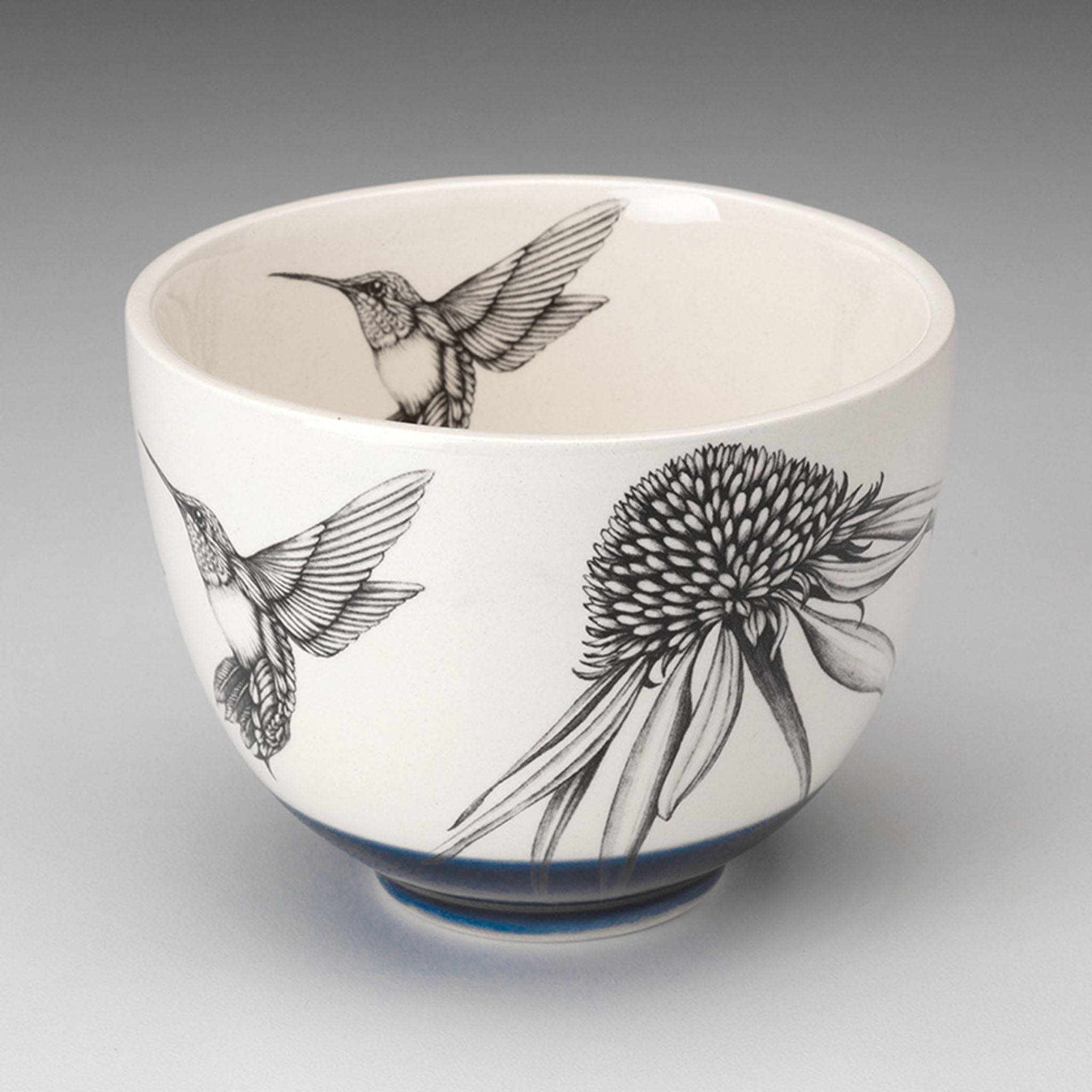 Laura Zindel Hummingbird #4 Small Bowl with blue bottom on grey background.