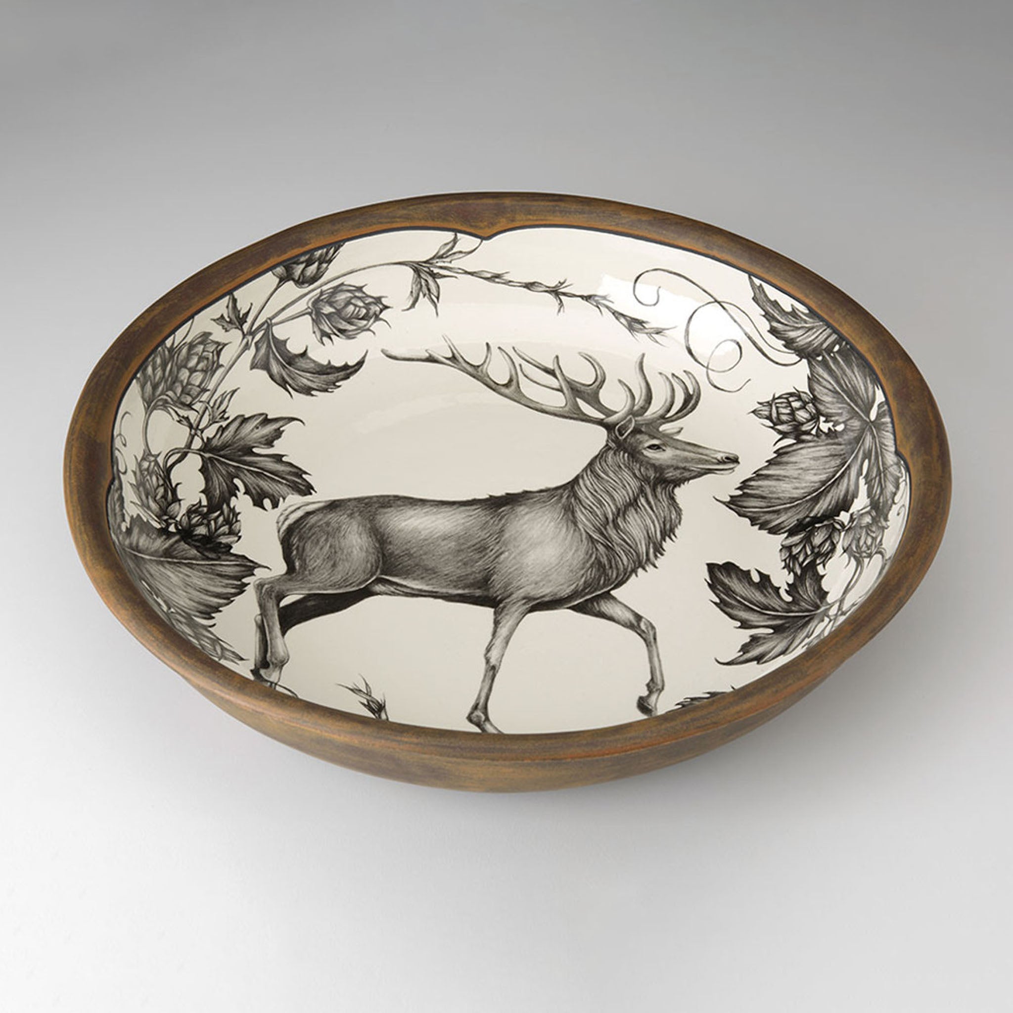 Decorative bowl with a deer design on a white background