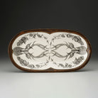 Decorative tray with deer antler design on a dark background