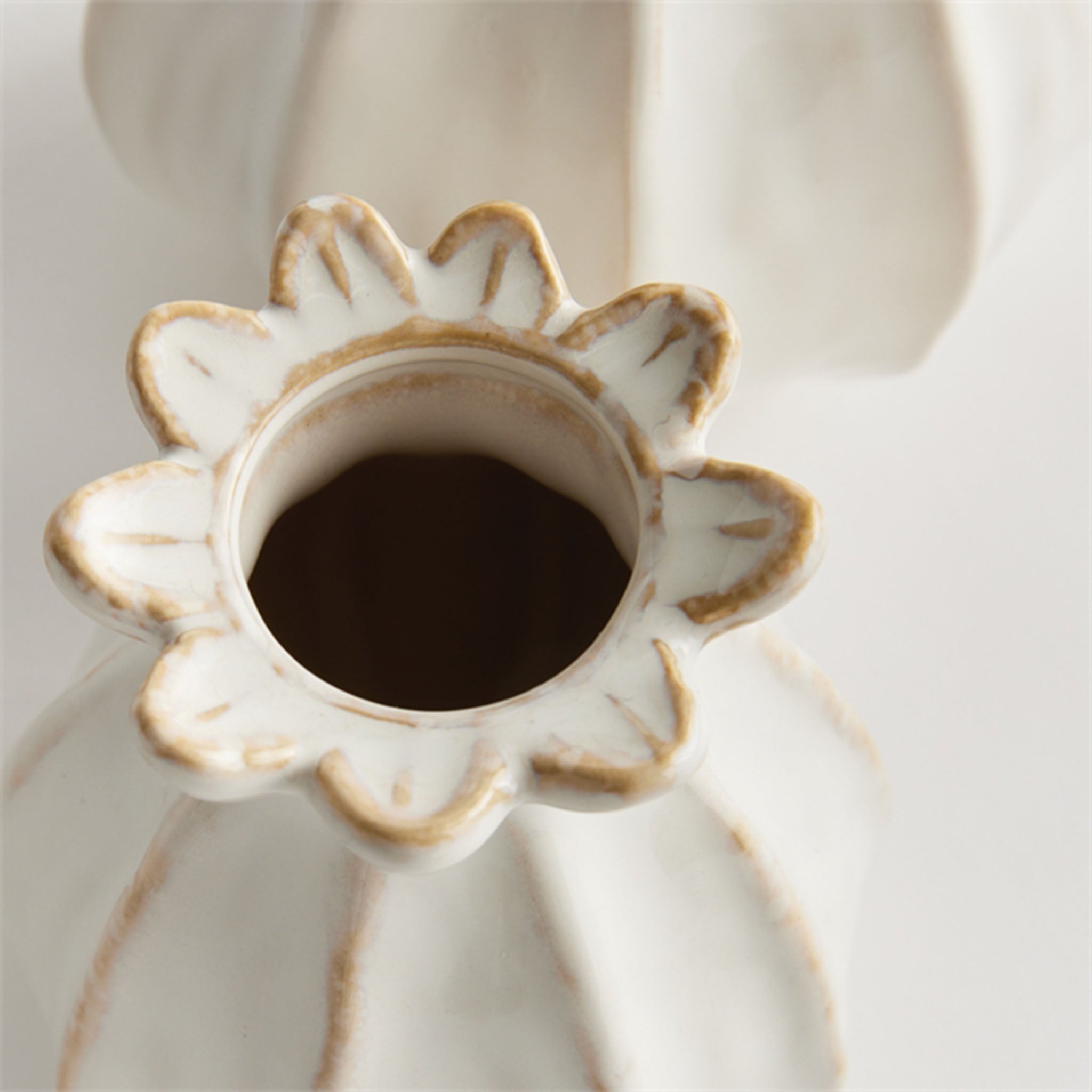 Small and large sculpted bud vase in white from Addison West home goods on a white background