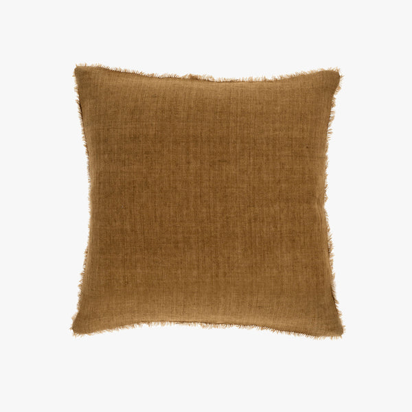 Tawny brown linen square pillow with frayed edges on a white background