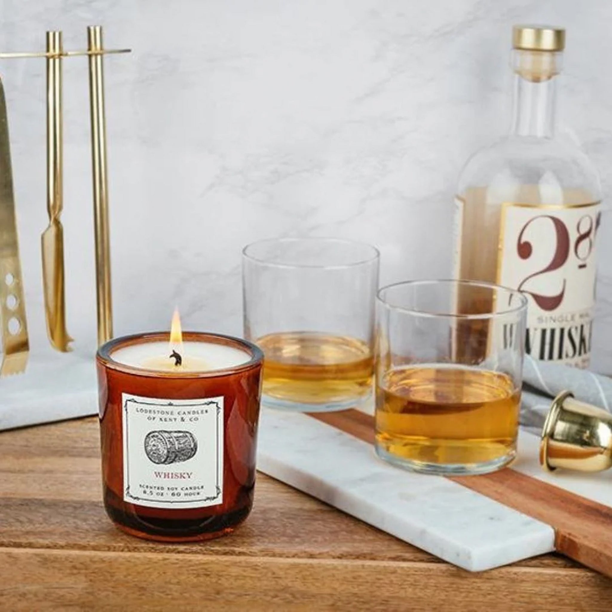 Lodestone Whiskey Candle on a bar cart at Addison West