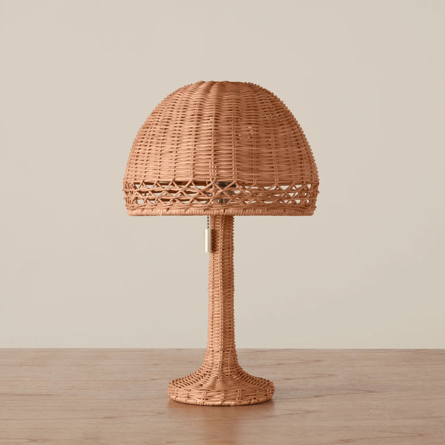 Augusta Mini Table Lamp on a beige background and wood table