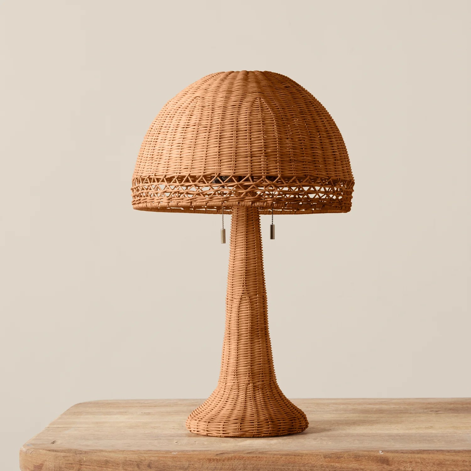 Augusta Table Lamp on a beige background and wood table