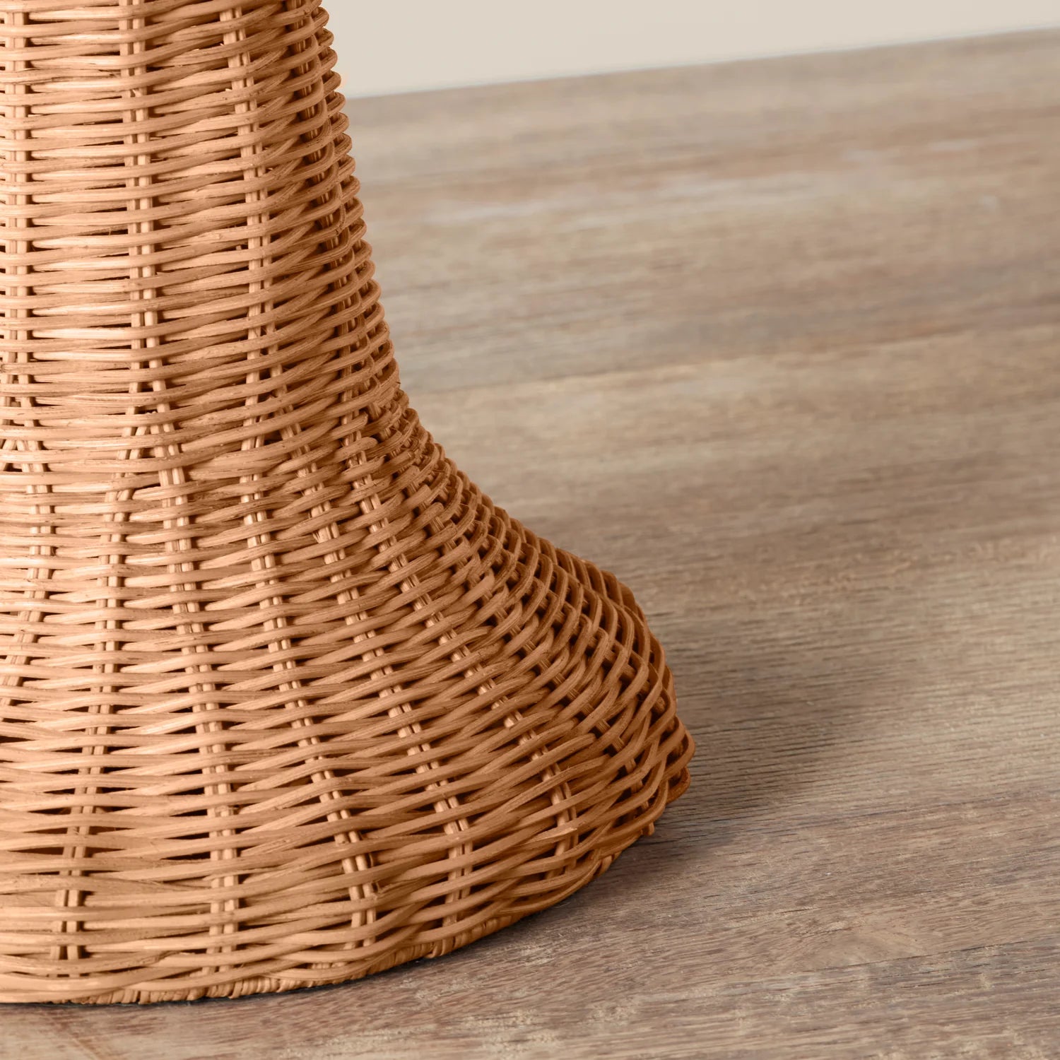 Augusta Table Lamp base on a beige background and wood table