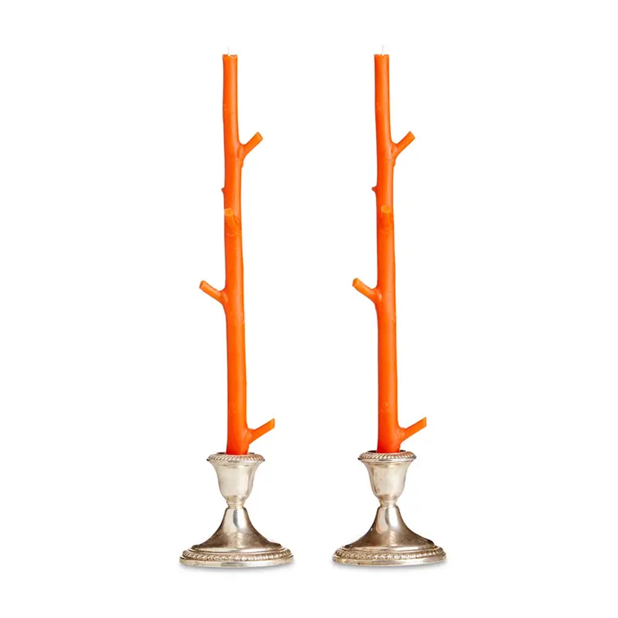 Two orange branch-like candle holders with silver bases on a white background