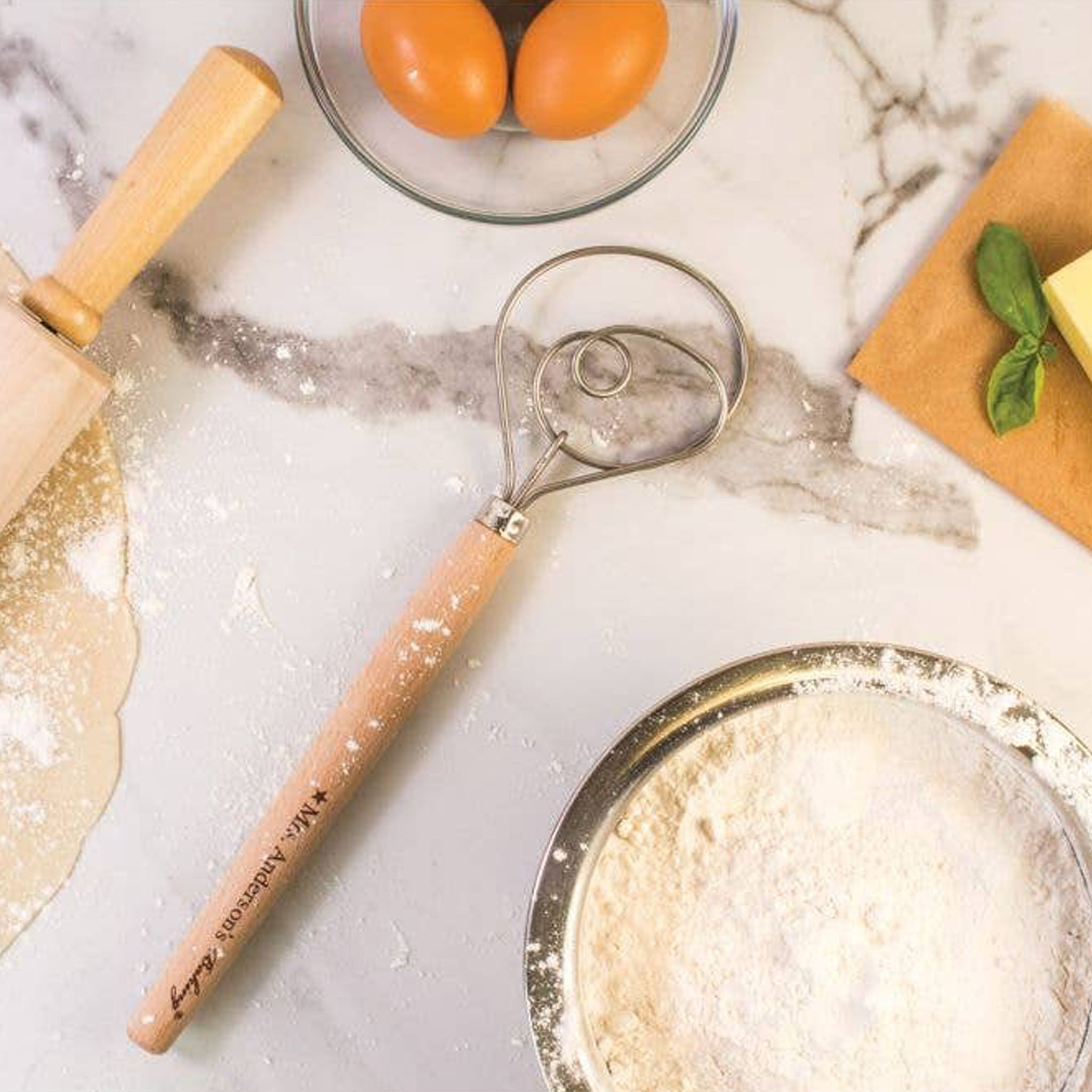 Mrs. Anderson's 12" Baking Dough Whisk on a kitchen table at Addison West