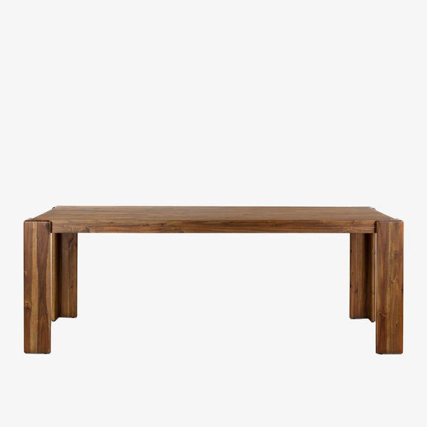 Four Hands Orla farmhouse style dining table in toasted acacia wood on a white background