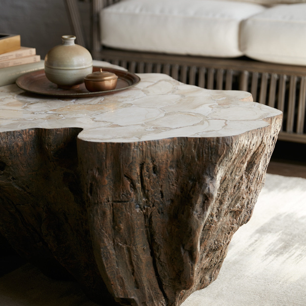 Palecek Chloe Fossil Clam Lava Coffee Table in living room at Addison West.