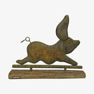 Rustic metal pig-shaped weathervane on a white background