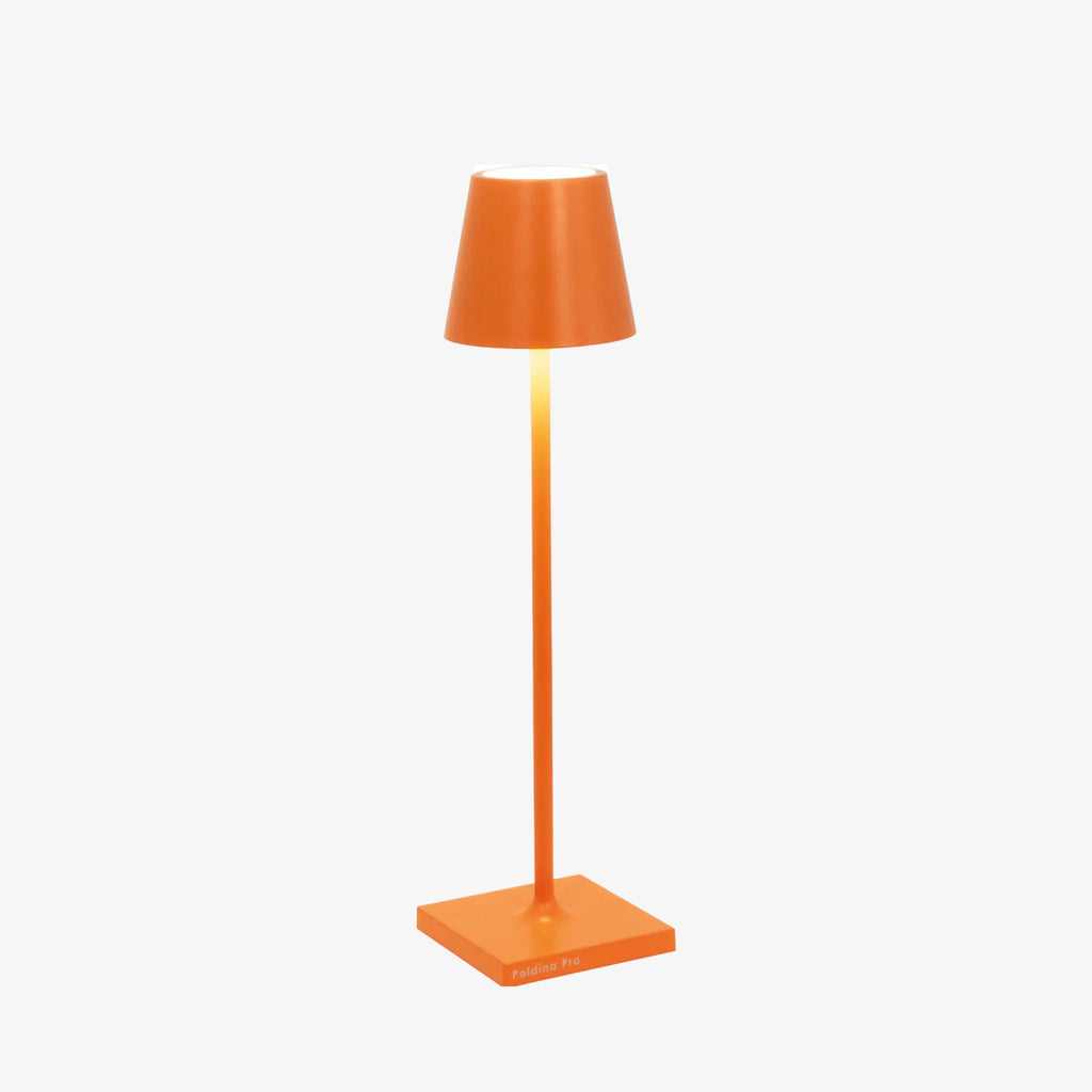 Poldina Pro micro table lamp in orange on a white background