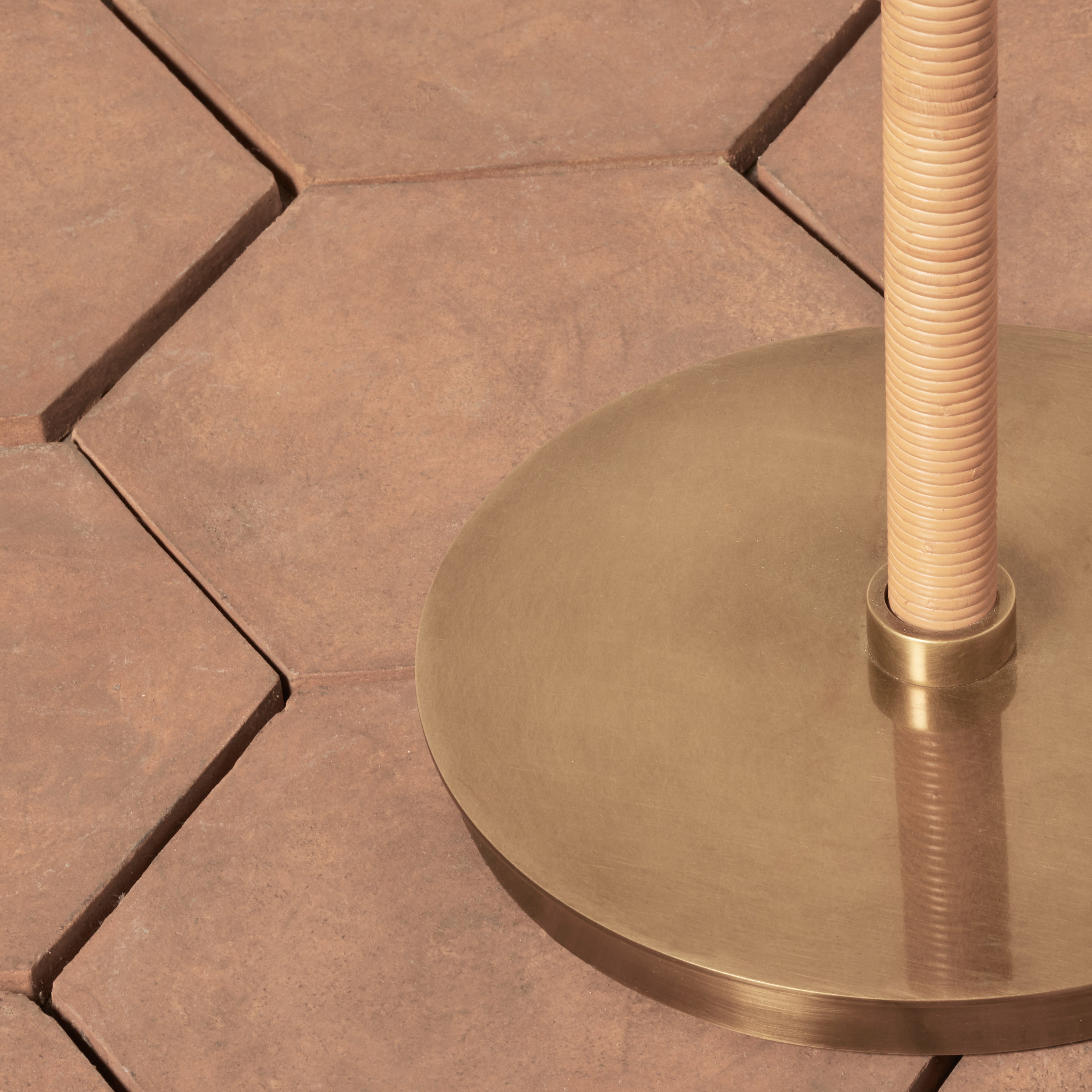 Close up of Delphine Floor Lamp on a red background at Addison West