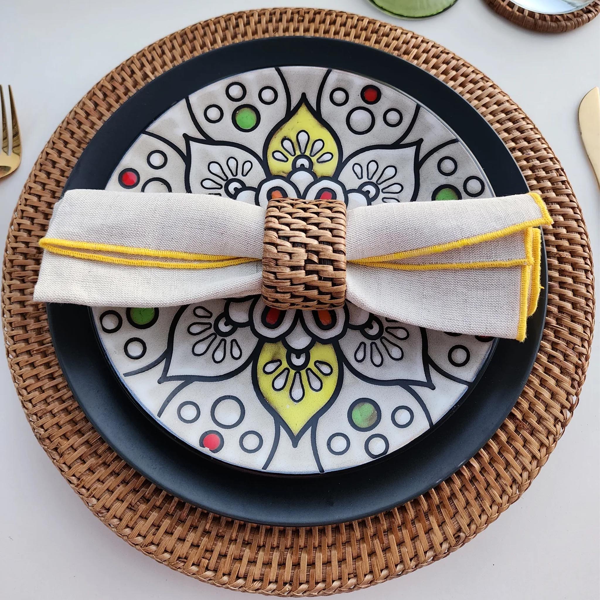 Rattan Oval Napkin Rings, Set of 4 on a table at Addison West