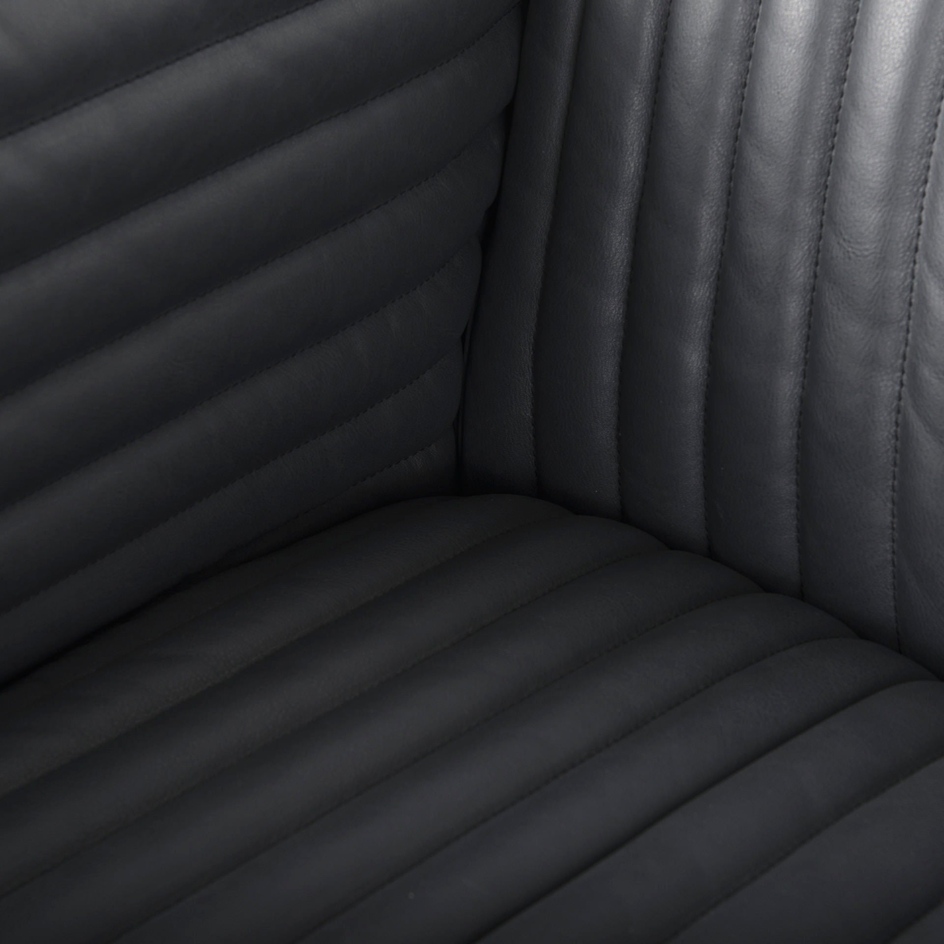 Close up of Ricciardo ribbed Black Leather Wrapped Three Seater Sofa