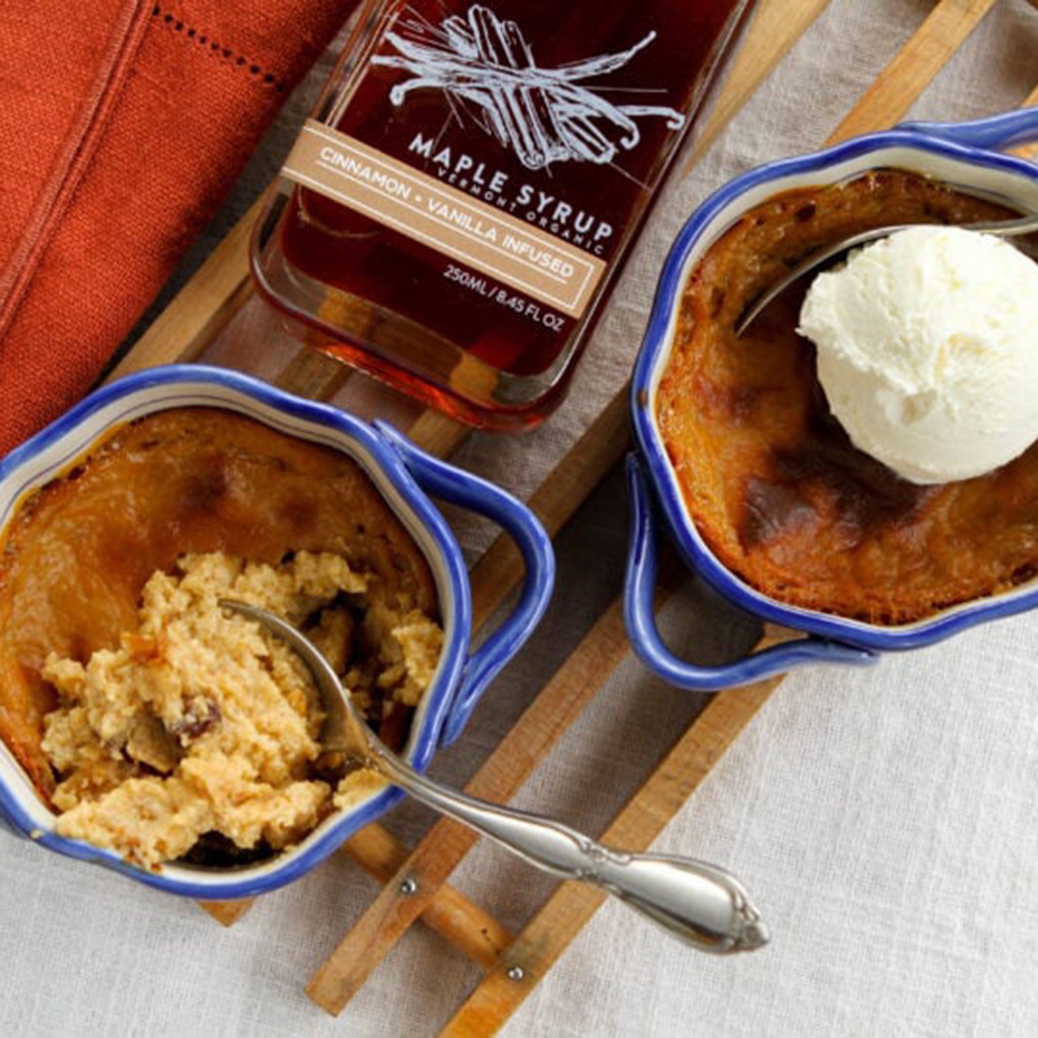 Runamok Cinnamon & Vanilla Infused Maple Syrup on a table with food at Addison West