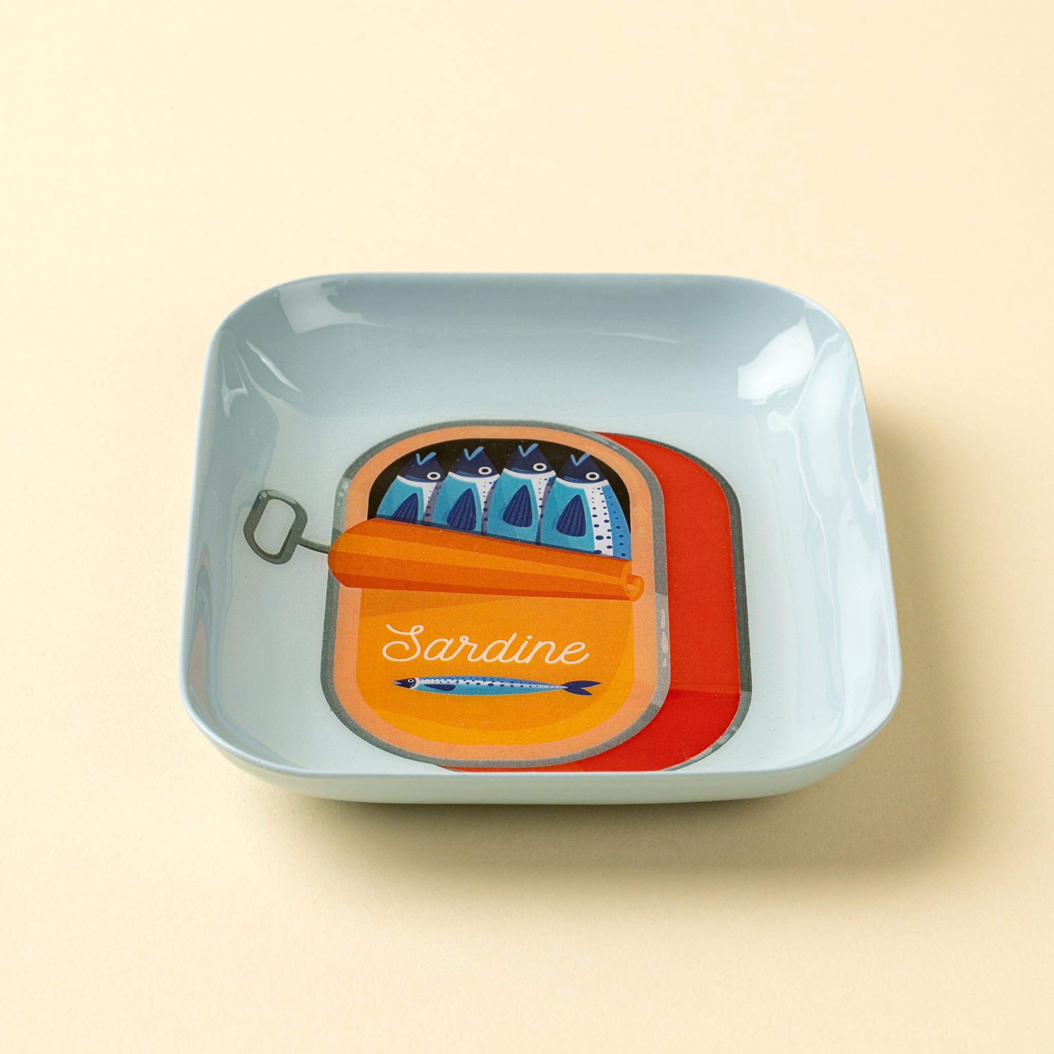 Sardine Enameled Tray on a beige background at Addison West