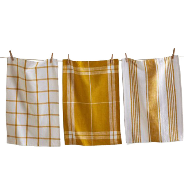Set of three honey yellow dishtowels on a cloths line with clothespins on a white background