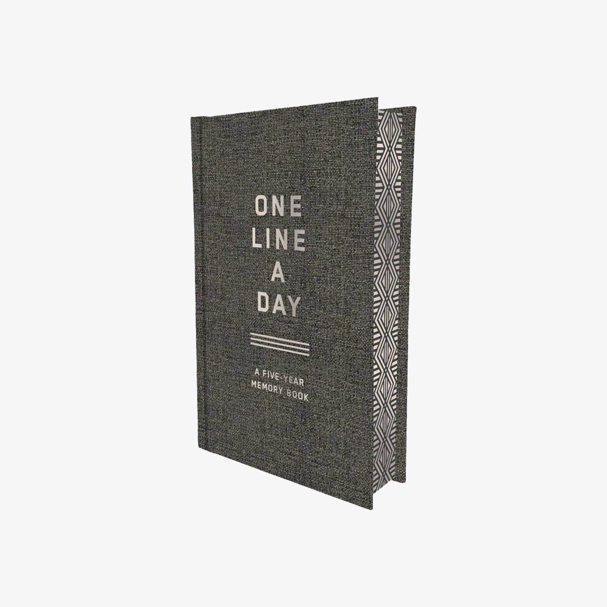 Gray memory book titled 'One Line a Day' on a white background