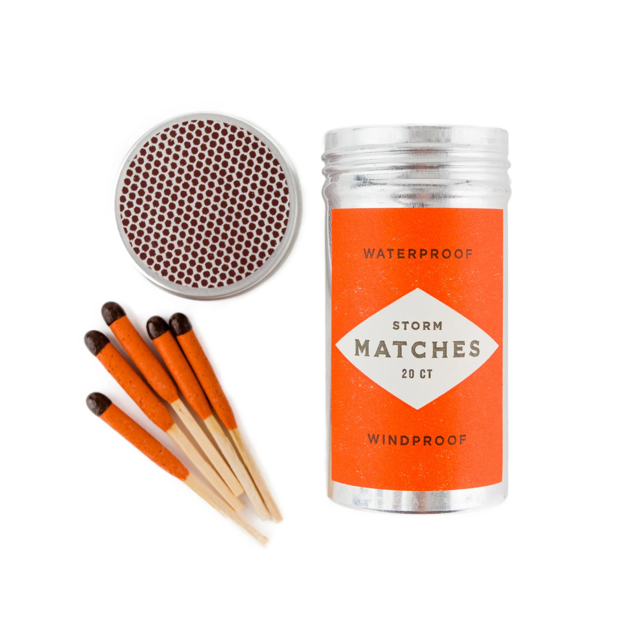 Metal cylinder of orange storm matches on a white background