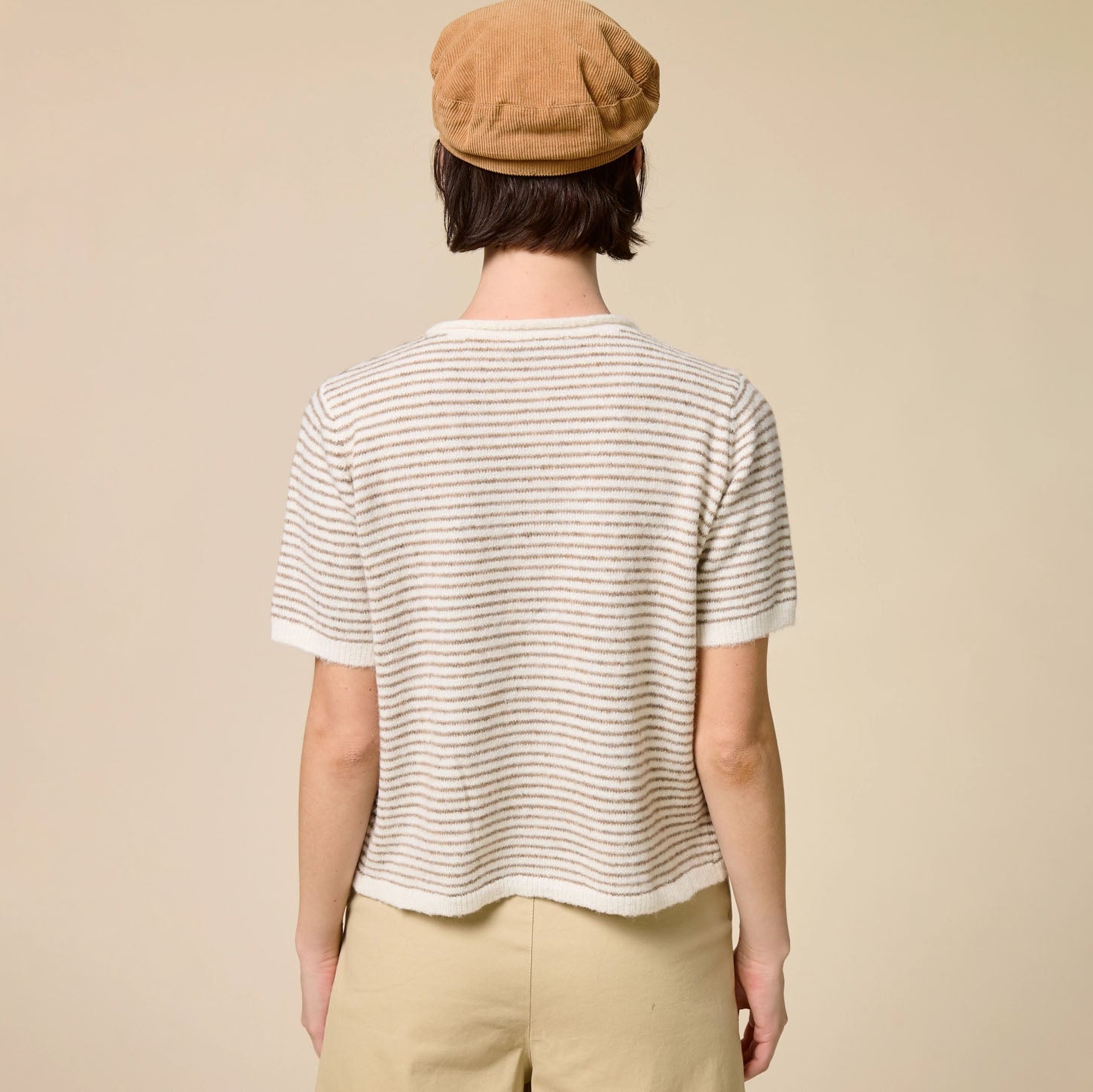Striped Short Sleeve Button Cardigan in Taupe shown on model on plain background.