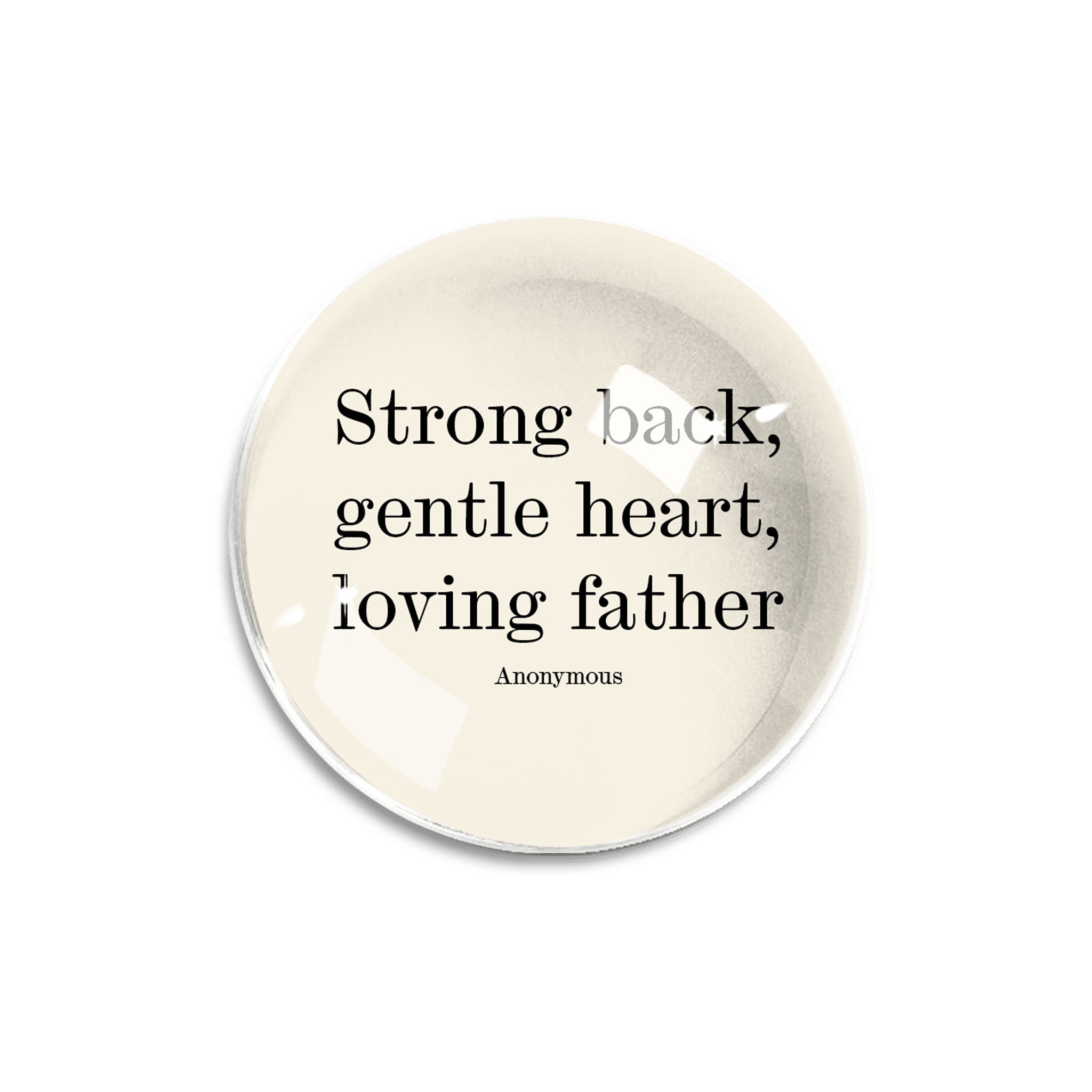 'Strong back, gentle heart' quotation on round glass paperweight on a white background