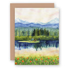 Water color greeting card with woods and mountains and small camper